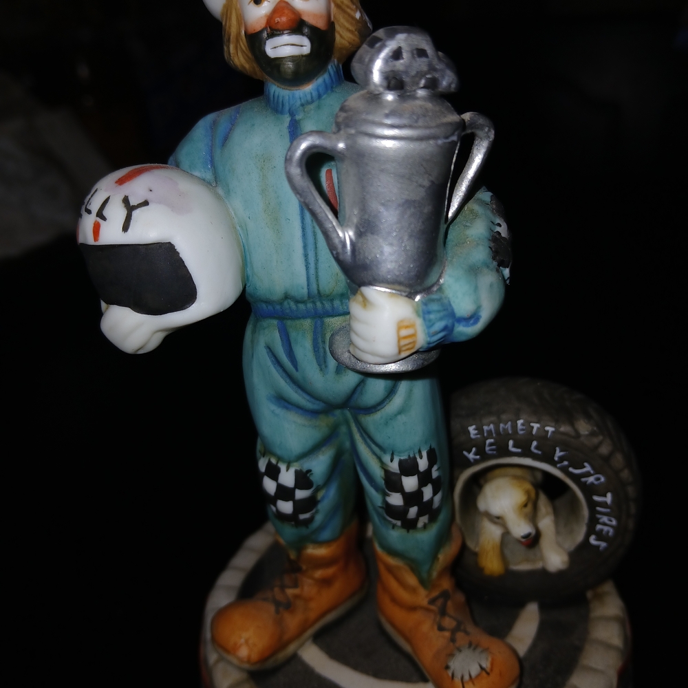 Blue Racing Driver Sculpture Holding Silver Trophy